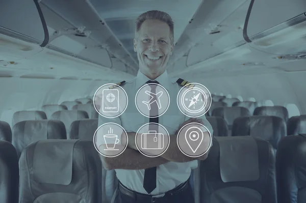 Cheerful pilot standing inside airplane — Stock Photo, Image