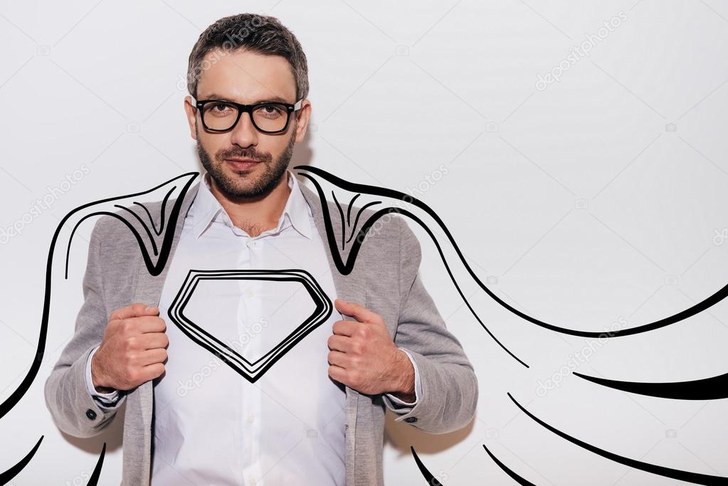 Confident man looking like superhero