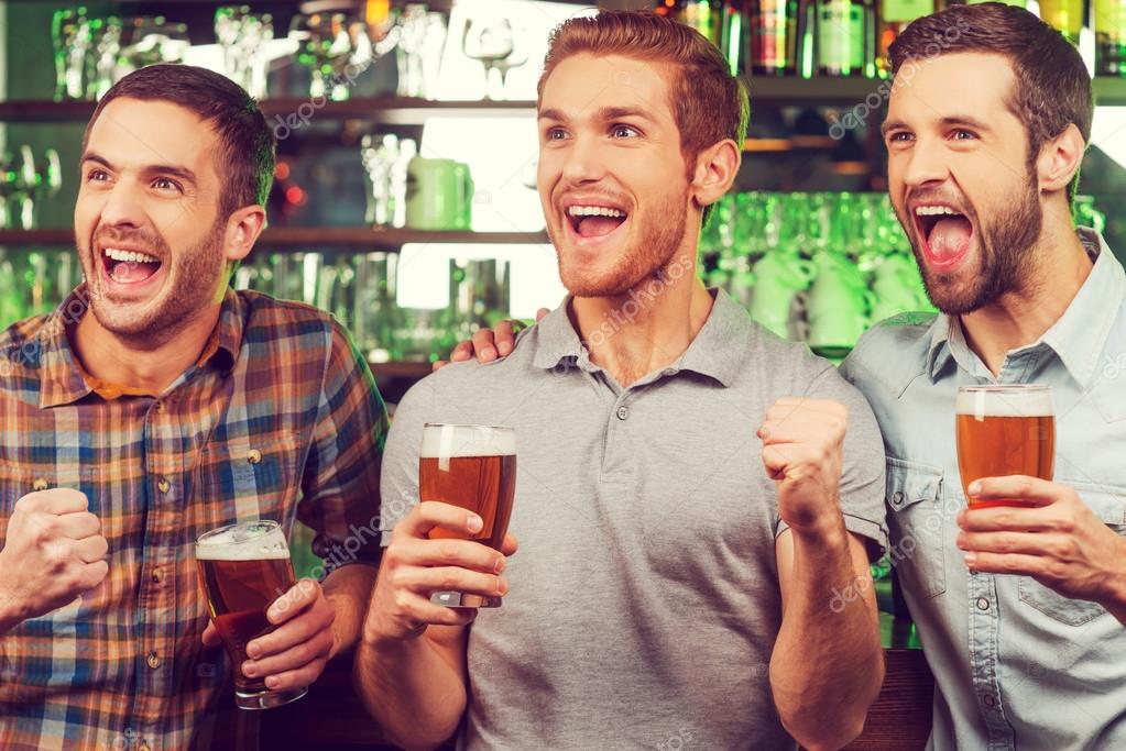 Happy Young Men With Beer Stock Photo C Gstockstudio
