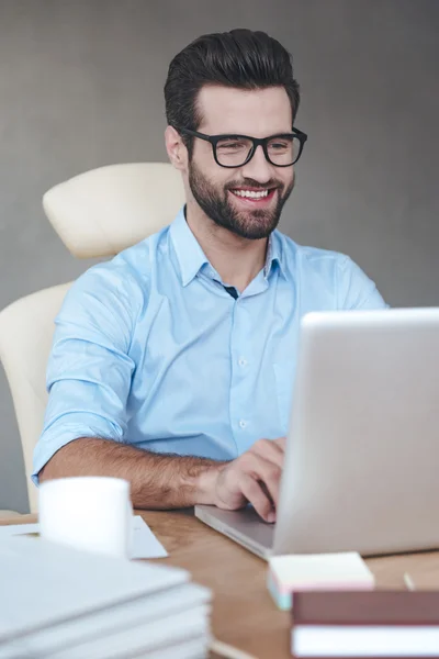 Handsome working with laptop in office — Stock Photo, Image