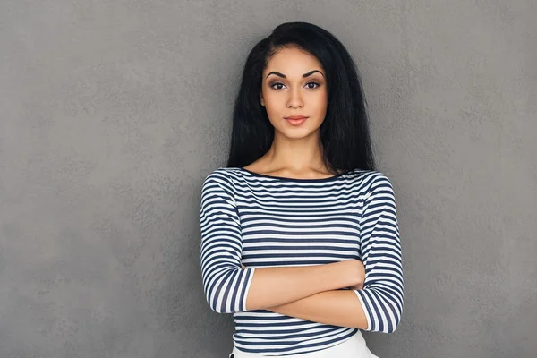 Beautiful young woman with arms crossed — Stock Photo, Image