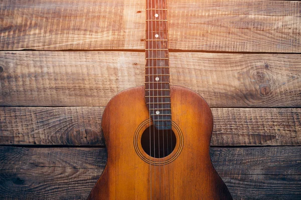 Acoustic guitar on wooden background — Stock Photo, Image