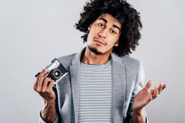 African man holding retro  camera