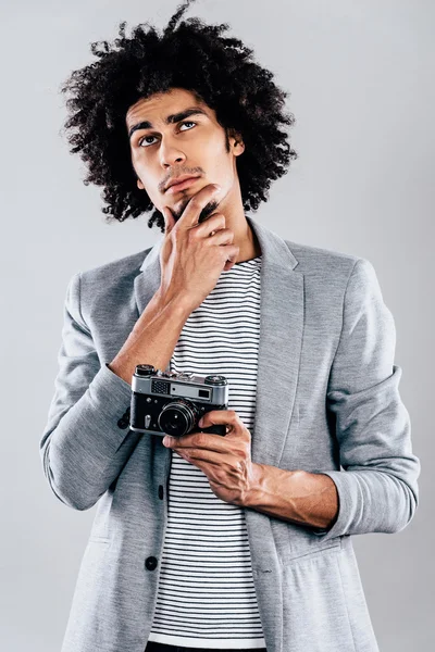 African man holding retro  camera — Stok fotoğraf