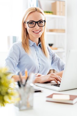 young beautiful woman in glasses looking