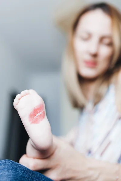 Kissed baby foot — Stock Photo, Image