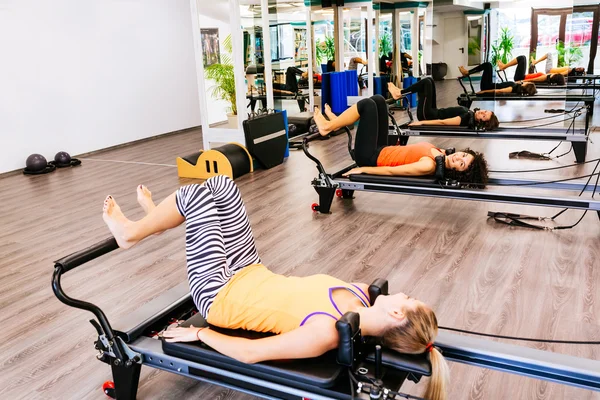 Women exercising on reformer beds — Stock Photo, Image