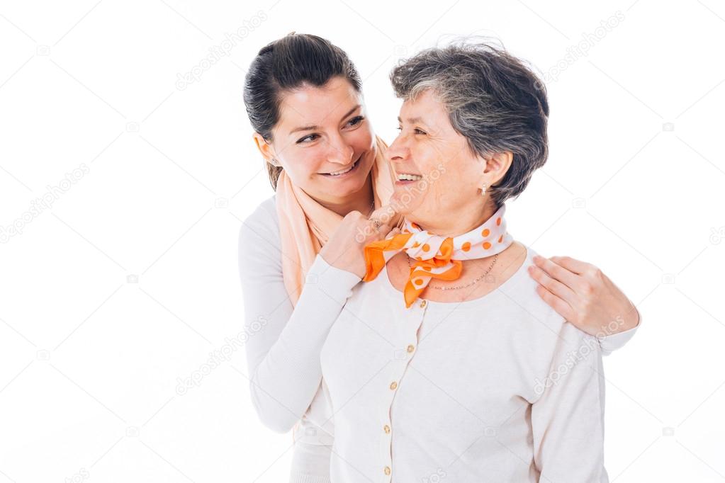 Senior mother and adult daughter laughing