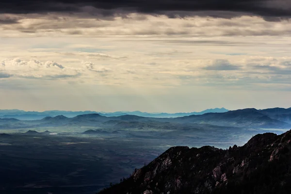 Sullen sky over mountains — Stock Photo, Image