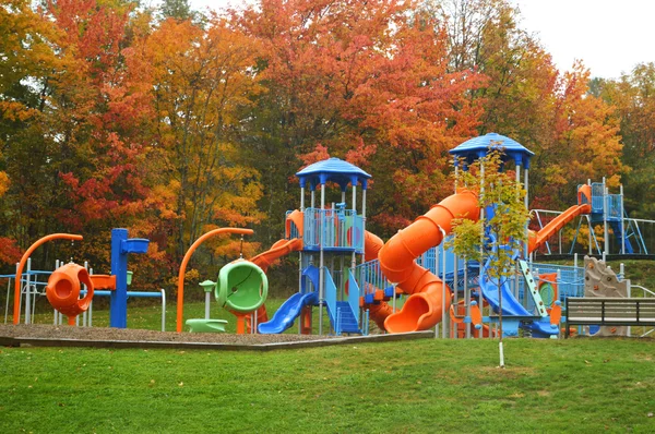 Красочная детская площадка осенью — стоковое фото