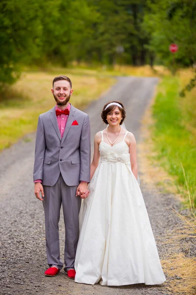 Bride and Groom on Gravel Road — Stock Photo, Image