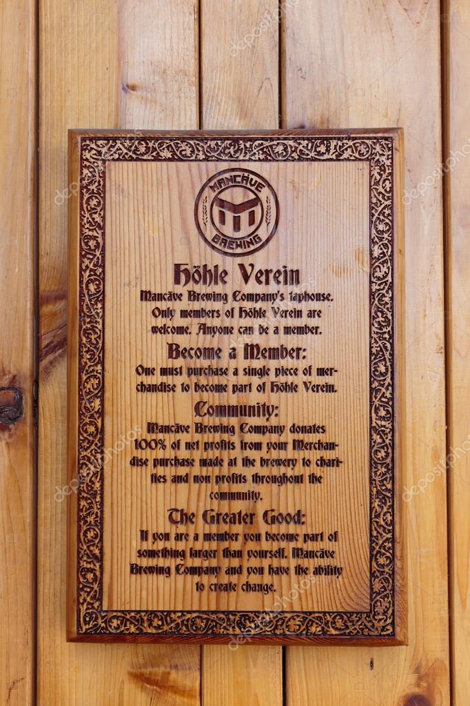 EUGENE, OR - NOVEMBER 4, 2015: Laser engraved wooden sign at the startup craft brewery Mancave Brewing.