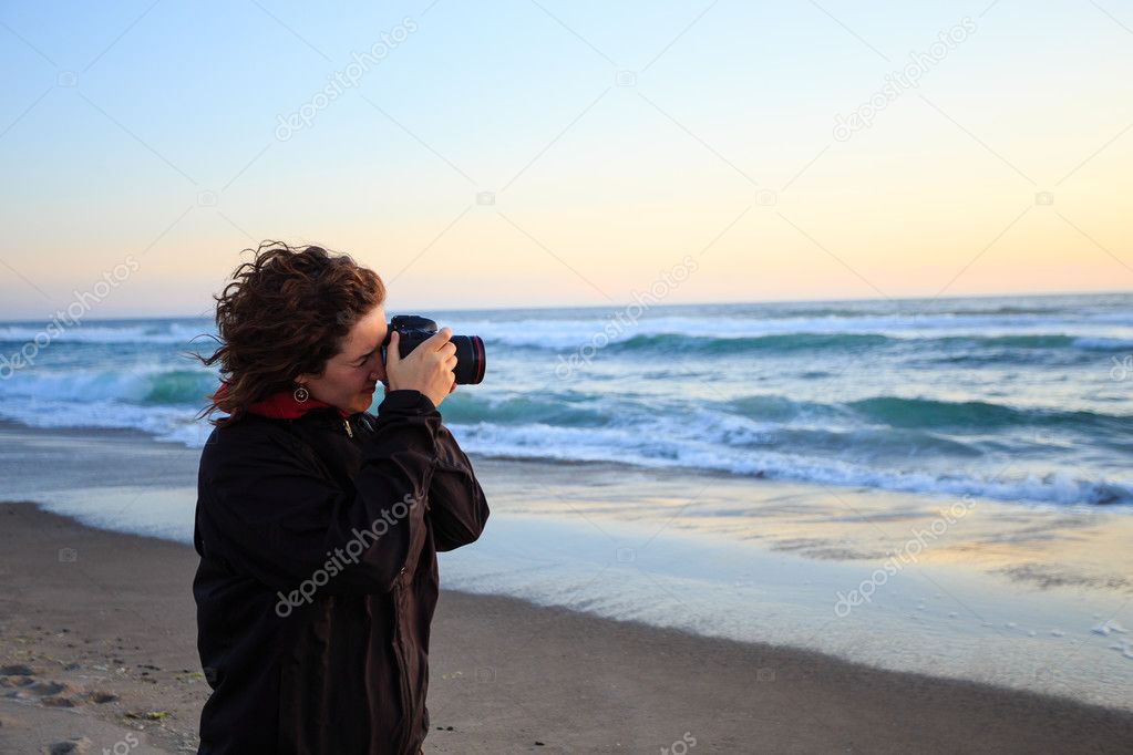 Woman With Camera at Sunset