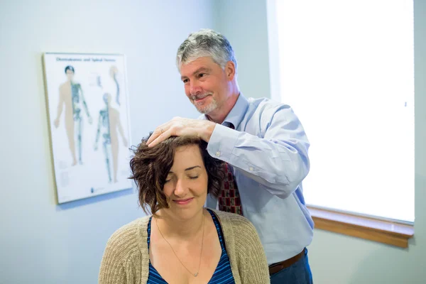 Chiropractor Adjusting Adult Woman in Office — Stock Photo, Image