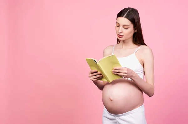 Young Calm Pregnant Woman Holding Book Future Parents Isolated Pastel — Stock Photo, Image