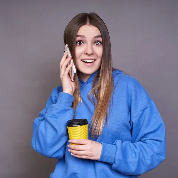 Vertical Shot Surprised Cheerful Blonde Girl Blue Sweatshirt Talking Phone — Stock Photo, Image