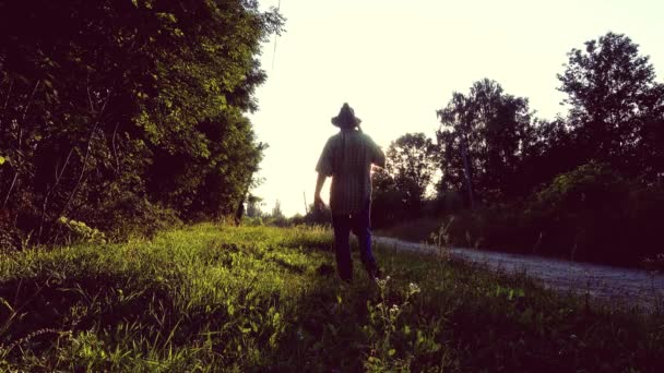 Man Mows Grass Hand Scythe Silhouette — Stock Video