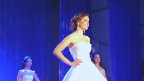 VINNITSA, UKRAINE - DECEMBER 12: Competition "Bride of the Year ".  Showing wedding dresses on stage.Contestants "Bride of the year 2014". December 12, 2014 in Vinnitsa, Ukraine. — Stock Video