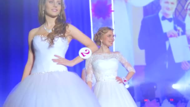 VINNITSA, UKRAINE - DECEMBER 12: Competition "Bride of the Year ".  Showing wedding dresses on stage.Contestants "Bride of the year 2014". December 12, 2014 in Vinnitsa, Ukraine. — Stock Video