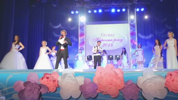VINNITSA, UKRAINE - DECEMBER 12: Competition "Bride of the Year ". Showing wedding dresses on stage.Contestants "Bride of the year 2014". December 12, 2014 in Vinnitsa, Ukraine. — Stock Video