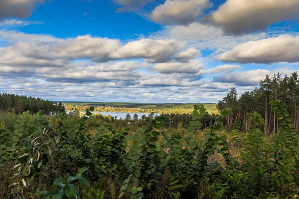 Beautiful cloudy sky. Daytime walk along the lakes and in the forest. Kiev region. Ukraine. 18 October 2020