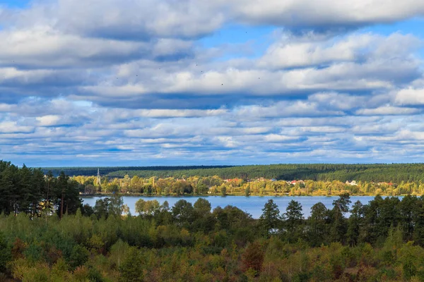 Beautiful cloudy sky. Daytime walk along the lakes and in the forest. Kiev region. Ukraine. 18 October 2020