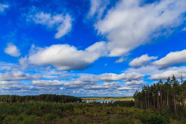 Beautiful cloudy sky. Daytime walk along the lakes and in the forest. Kiev region. Ukraine. 18 October 2020