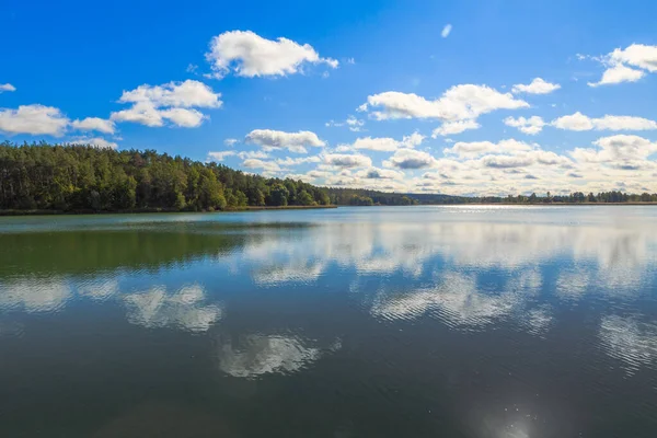 Beautiful cloudy sky. Daytime walk along the lakes and in the forest.