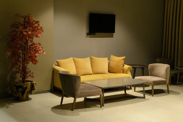 evening interior sofa and armchair TV table