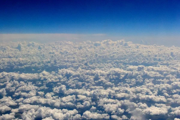 Fluffy clouds from fly — Stock Photo, Image