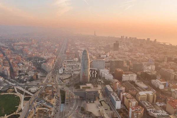 Aerial drone shot of agbar tower by Barcelona beach with sunrise — Foto de Stock