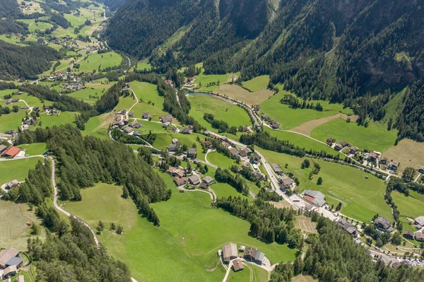 Aerial drone shot of Helligenblutt village in Grossglockner mountain valley in Austria — Stock Photo, Image