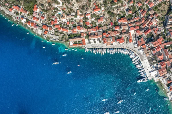 Aerial overhead drone shot of yachts on Adriatic sea near Vis Island in Croatia summer