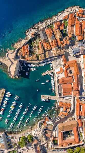 Aerial overhead drone shot of Dubrovnik old town port in Adriatic sea in Croatia summer