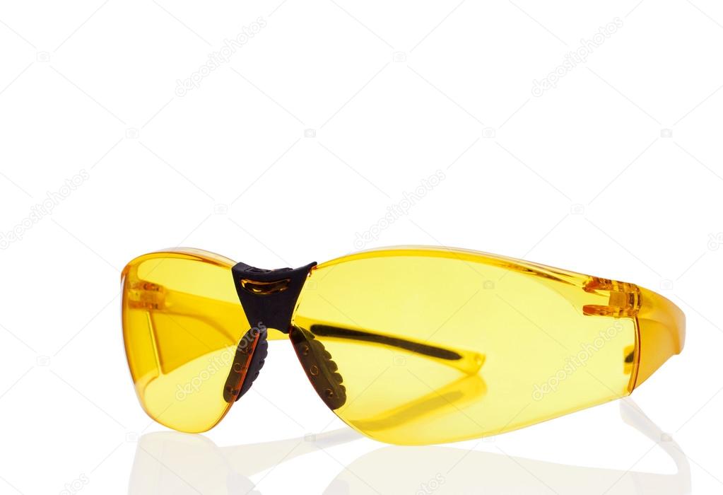 Yellow safety glasses isolated on white.