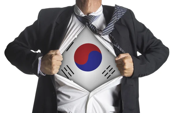 Corea del Sud Bandiera con uomo d'affari che mostra una tuta da supereroe sotto — Foto Stock