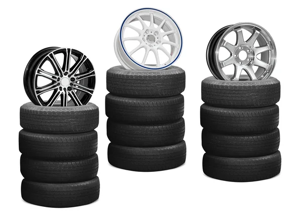 Car alloy wheels on pile tires — Stock Photo, Image