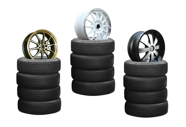 Car alloy wheels on pile tires — Stock Photo, Image