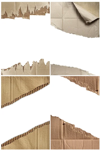 Hole ripped in corrugated cardboard — Stock Photo, Image