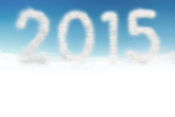 Nuvem no céu azul com uma forma de número 2015 — Fotografia de Stock