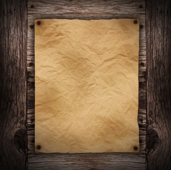 Paper sheet on dark wood — Stock Photo, Image