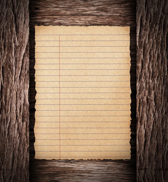 Paper sheet on dark wood — Stock Photo, Image