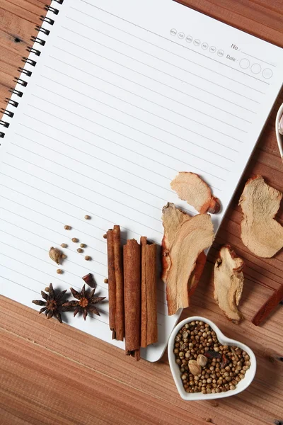 Recipe book with spices — Stock Photo, Image
