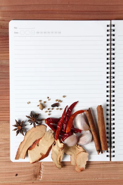 Recipe book with spices — Stock Photo, Image