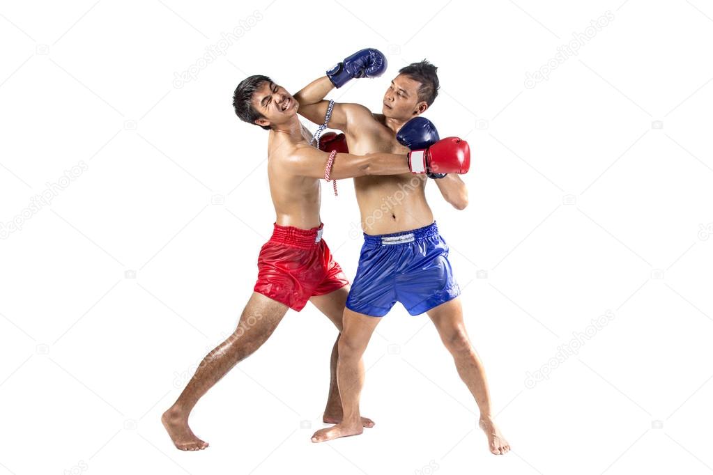 Two thai boxers exercising traditional martial art