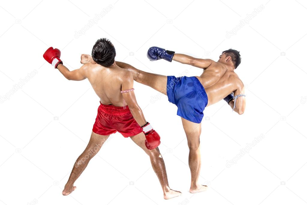 Two thai boxers exercising traditional martial art