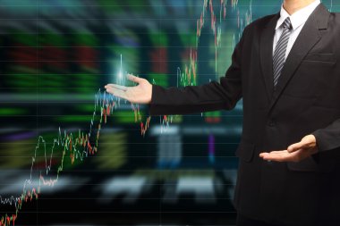 iş adamı el borsa grafik arka planı ile tutarak