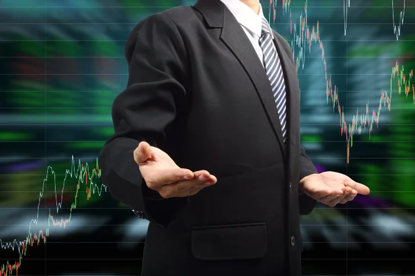 Business Man hand holding with stock market graph background — Stock Photo, Image