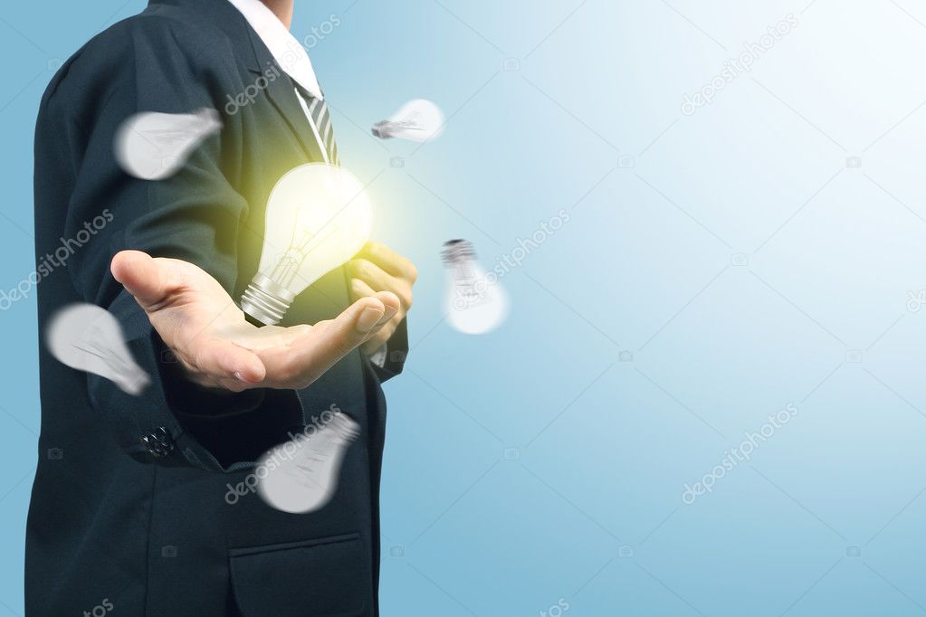 Businessman with illuminated light bulb concept for idea