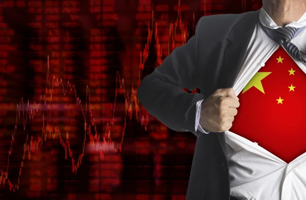 Stock market chart background with china flag with showing a superhero — Stock Photo, Image